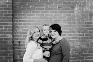 birth mother, adoptive mother and child